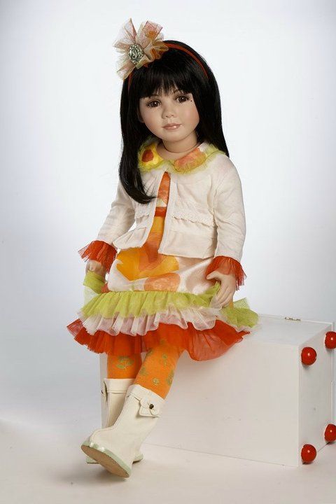   doll. The doll does come with a small orange busy box / suitcase not